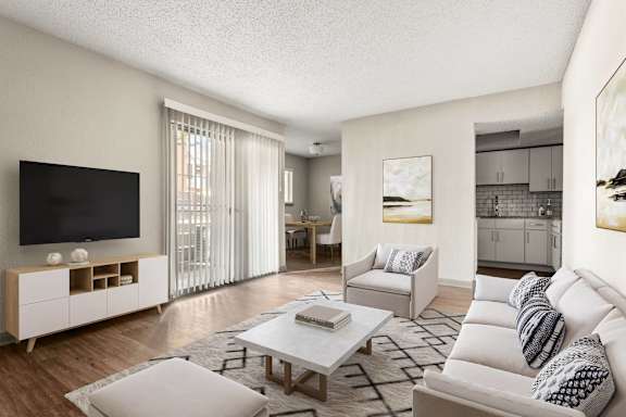 A modern living room with a white sofa and a wooden entertainment center.