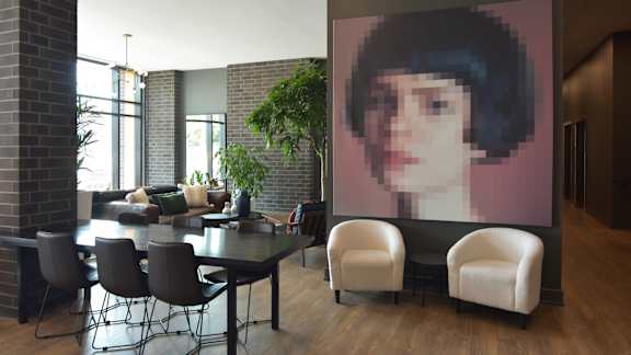 Modern dining area with artistic wall display at 929 Richmond Apartments, Ottawa, Ontario