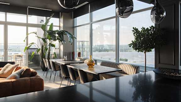 A modern dining room with a view of the city at Petries Landing I Apartments , Ottawa, Ontario