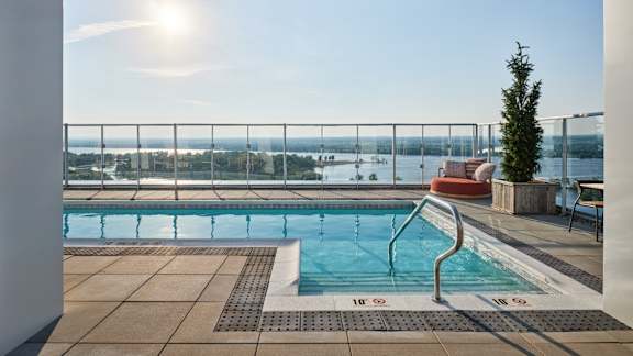 A sunny day at the pool with a view of the city. at Petries Landing I Apartments , Ottawa, ON