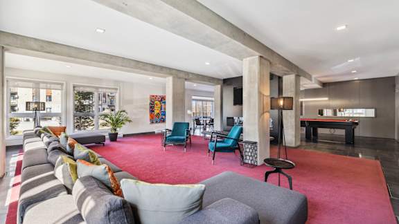 Modern open concept living room with pool table at Horizon Apartments, Gatineau, J9A 0G9