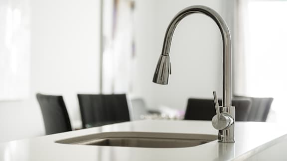 Kitchen sink with pull down faucet at Kanata Lakes Apartments, Ottawa, ON