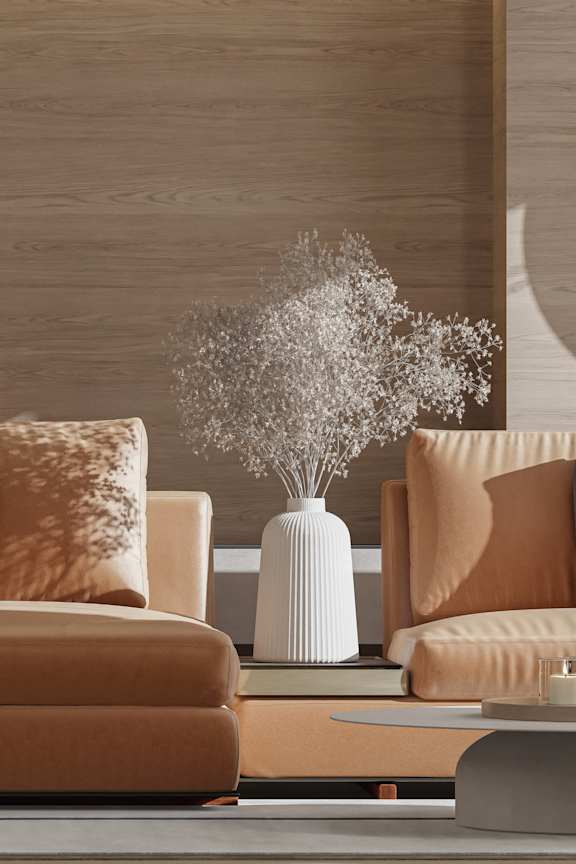 A living room with a white couch and a large window.