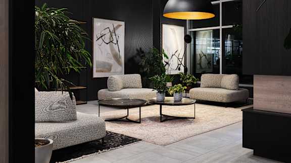 Modern lobby with contemporary seating and artwork at Baseline Apartments, Ottawa, ON K2H 0C9