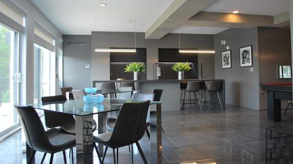Open concept dining area with glass table at Horizon Apartments, Gatineau