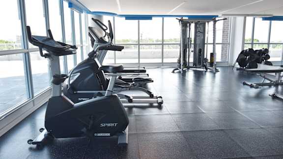 Fitness center with cardio and strength equipment at 929 Richmond Apartments, Ontario, K2B 6R1