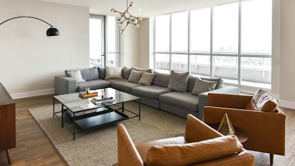 Contemporary living room with floor to ceiling windows at 929 Richmond Apartments, Ottawa, ON K2B 6R1