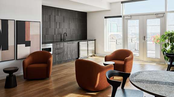 A modern living room with a dining table and chairs. at Le ColumbiaApartments , Gatineau, QC