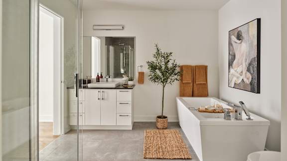 A bathroom with a white sink and a mirror.