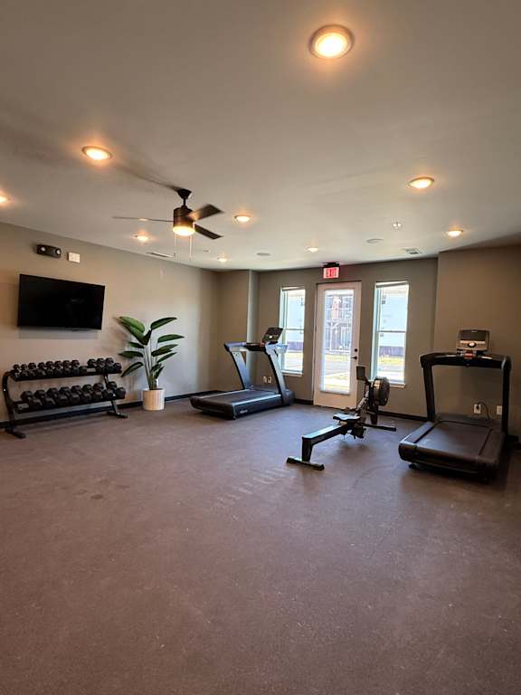 A room with a wall of lights and a flat screen TV.