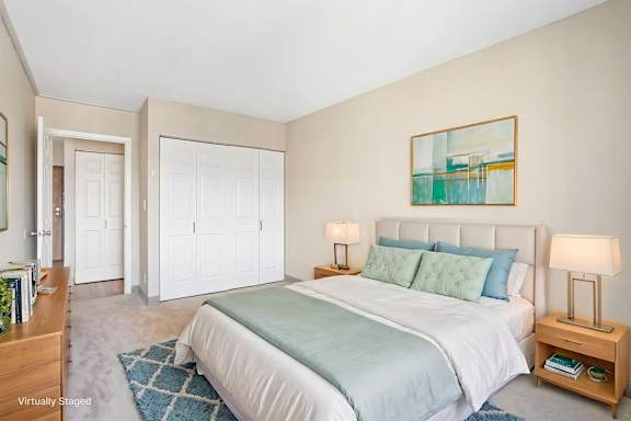Virtually staged Irvine Park Towers bedroom with contemporary furnishings and closet storage