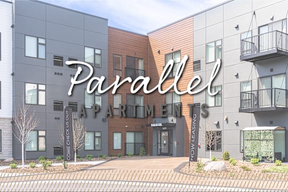 A modern apartment complex named Parallel Apartments invites prospective tenants to come and check out the units.