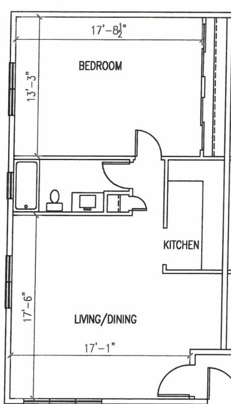 Floor Plan  A floor plan of a small apartment with a bedroom, kitchen, and living/dining area.
