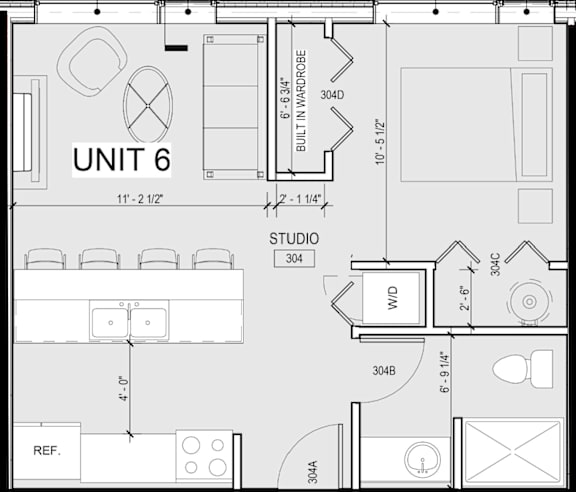 A floor plan of a unit with a living room, kitchen, and bathroom.