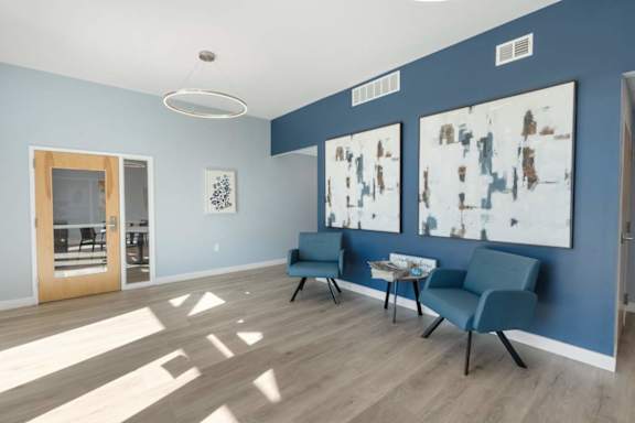 A room with blue walls and a white ceiling with a light fixture.