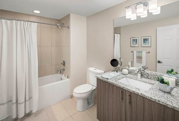 A modern bathroom with a white shower curtain and a white toilet. at Palma, Doral