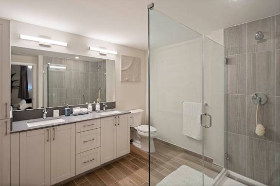 A bathroom with a walk-in shower and double sinks. at Palma, Florida