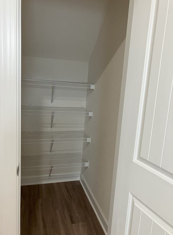 Empty white shelves in a room.