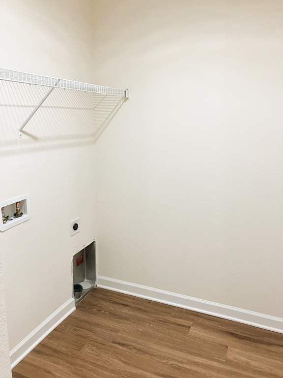 A white wall with a small hole in it.