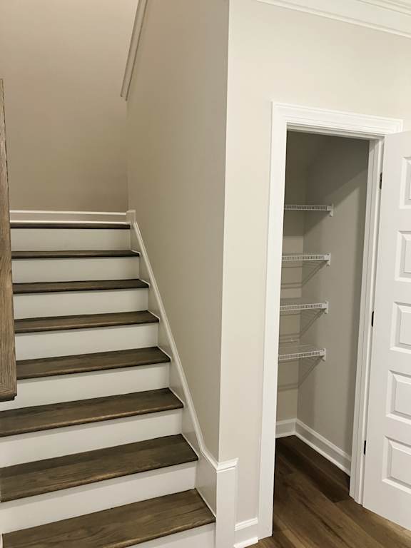 A white doorway with shelves inside.
