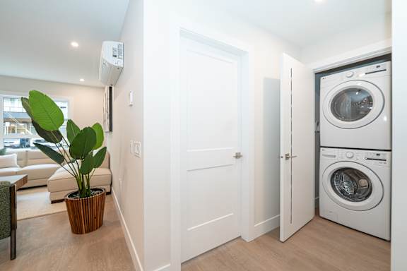 A modern laundry room with a washer and dryer.