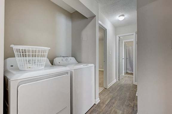 A white washer and dryer in a laundry room.