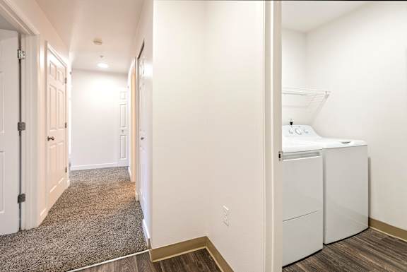 A laundry room with a washer and dryer.
