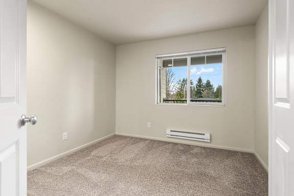 A room with a window and a door.