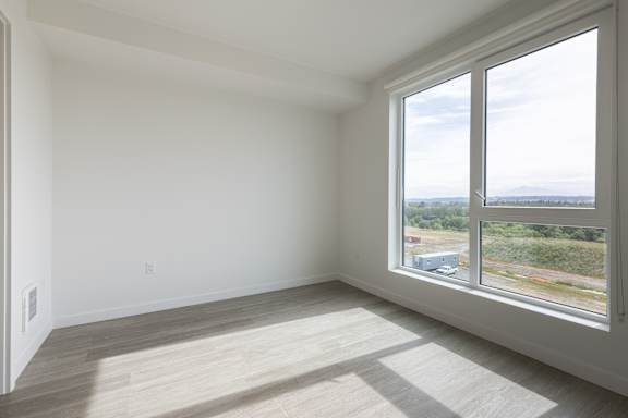 Empty bedroom with large windows and view 7 at Riverfront Everett Apartments, Everett, 98201