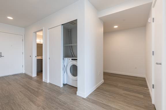 A laundry room with a washer and dryer in a home.