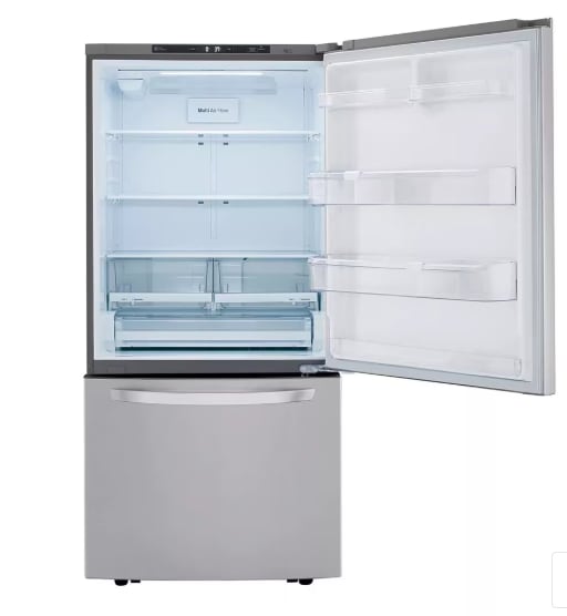 A white refrigerator with the door open and shelves inside.