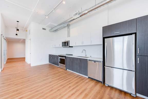 A kitchen with wooden floors and stainless steel appliances.at 2231 S Western, California