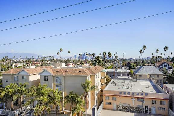 A residential area with houses and palm trees.at 2221 S Western, Los Angeles