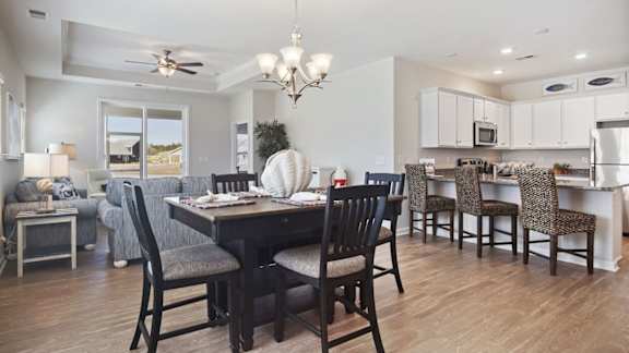 A dining room with a table set for six at Stepping Stone at Bridgewater Apartments, South Carolina