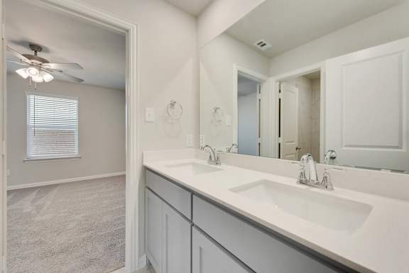 Bathroom with White Sink at Cottages at Beltmill Apartments, Saginaw, TX