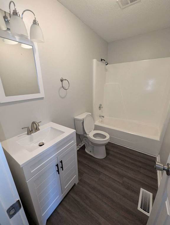 a bathroom with a toilet and a sink