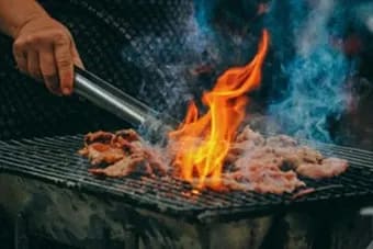 Grilling meat with a flame at Citizen on Jasper, Edmonton, Alberta