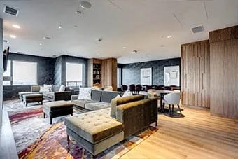 Modern living room with a variety of seating options at Citizen on Jasper, Edmonton
