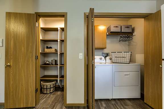 A laundry room with a washer and dryer. at Tranquility Pointe, Nebraska, 68164