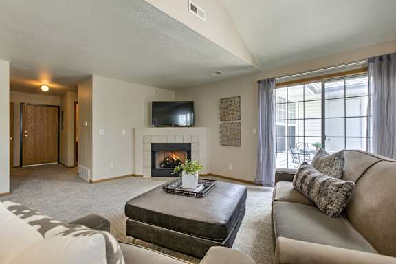 A living room with a fireplace at Tranquility Pointe, Omaha, NE, 68164