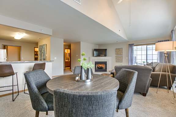 A modern living room with a fireplace  at Tranquility Pointe, Nebraska, 68164