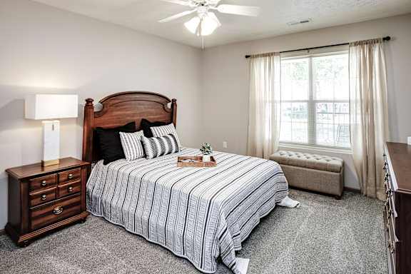 Bedroom With Expansive Windows at Standing Bear Lake, Omaha, NE