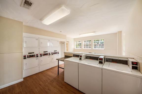 Shared laundry room with washers and dryers at Altamonte Apartments, Texas