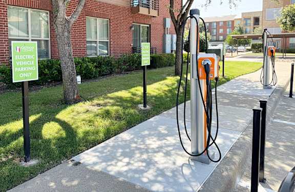 Electric vehicle charging stations with designated parking at Gateway Cedars Apartments, Forney, TX
