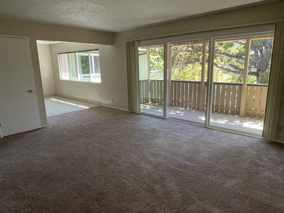 Living room with balcony view at The Orchard at Sunnyvale, Sunnyvale