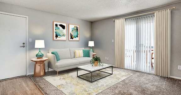 A living room with a white couch, a glass coffee table, and two lamps.
