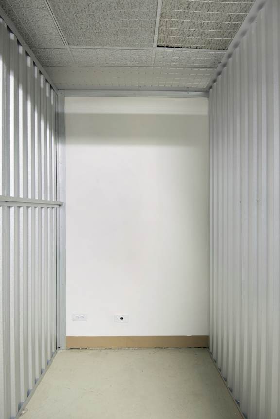 A white room with a white wall and a white floor.