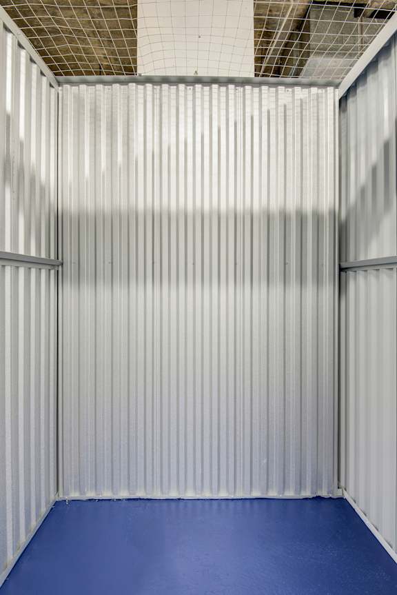 A room with a blue floor and white walls.