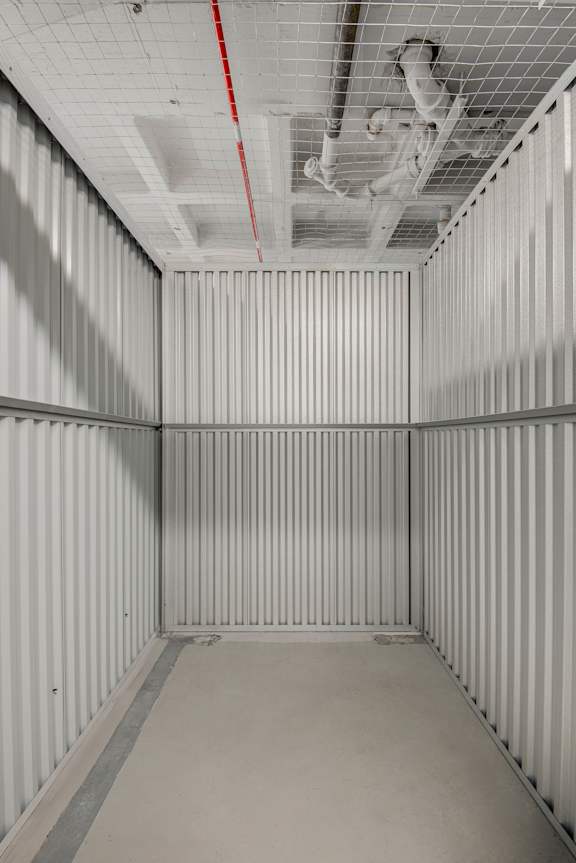 A white container with a red line on the ceiling.