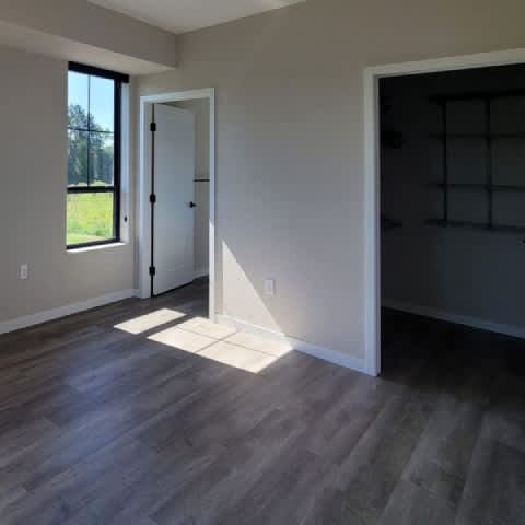 A room with a door and a window.